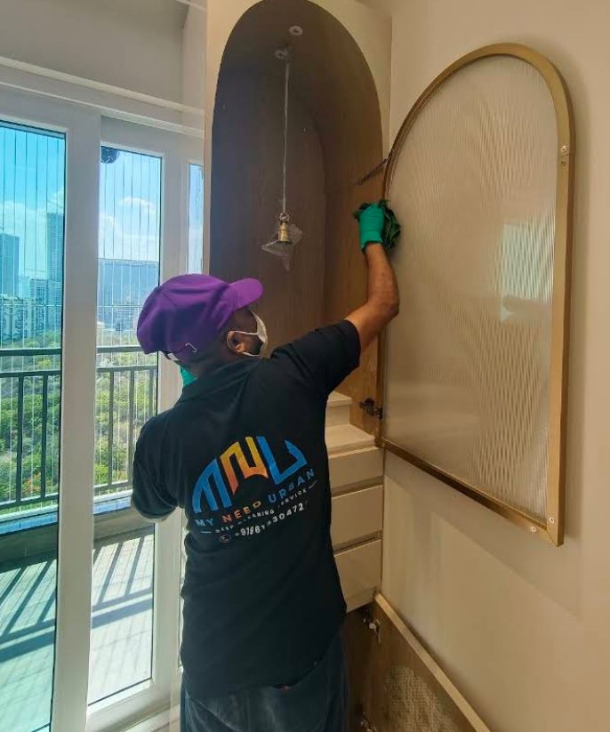 MyNeedUrban professional carefully cleaning a pooja unit